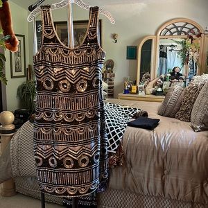 This jazzy beaded dress designed by Lawrence Kazar size L in excellent  shape .